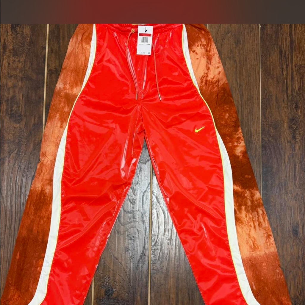 Nike Red Track Pants With White Piping And Yellow Swoosh